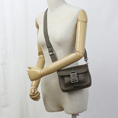 二手 Dior 单肩包 中性品牌 Dior Hit the Road 皮革卡其色包 USDCD101476011